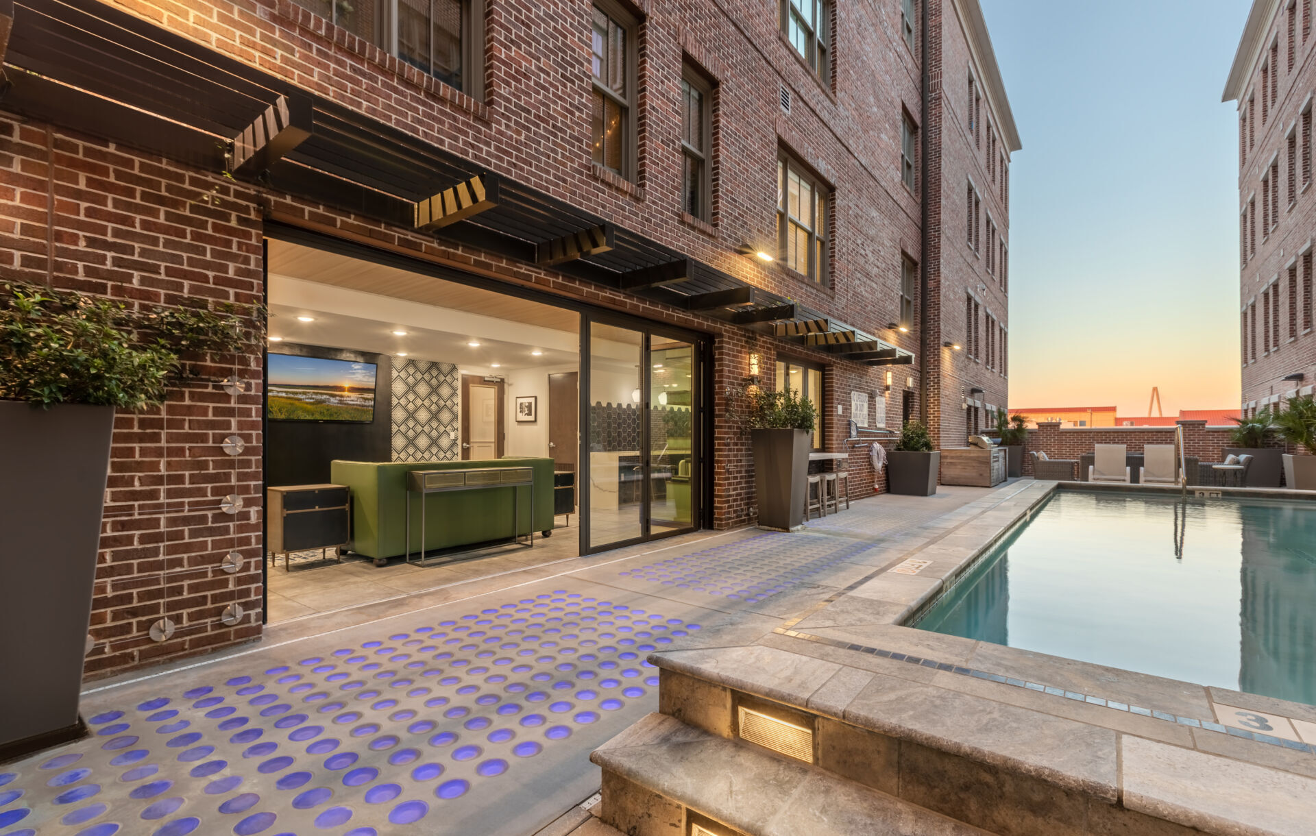 Glass pavers around pool.